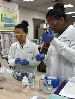 Two students in lab coats