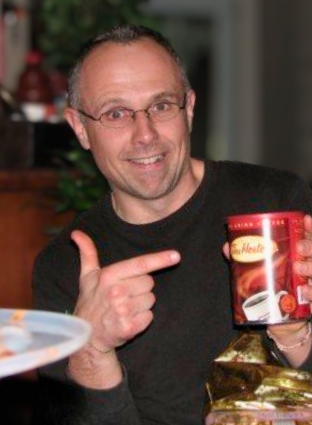 Photo of Steve Polyak holding a can of Tim Hortons coffee