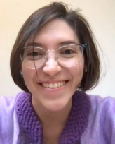 Headshot photo of Paz. She is pictured smiling.